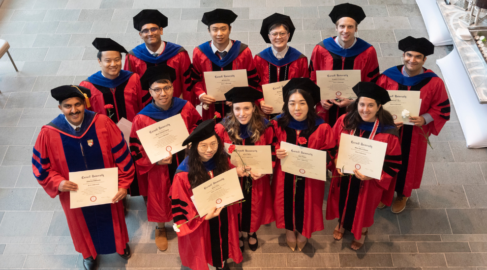 Students dressed in graduation regalia during commencement